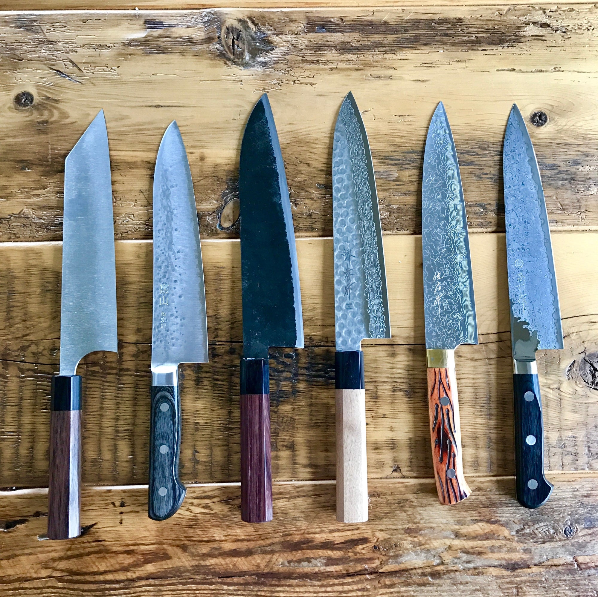 a collection of japanese chefs knives