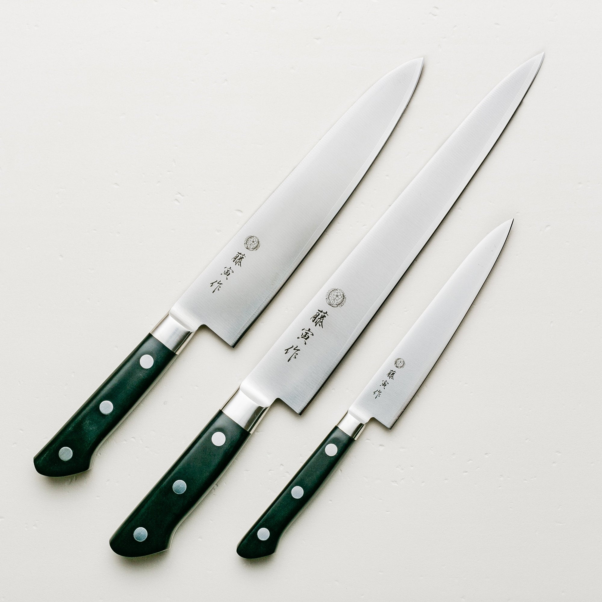 Tojiro DP 3 piece Knife Set on white linen background